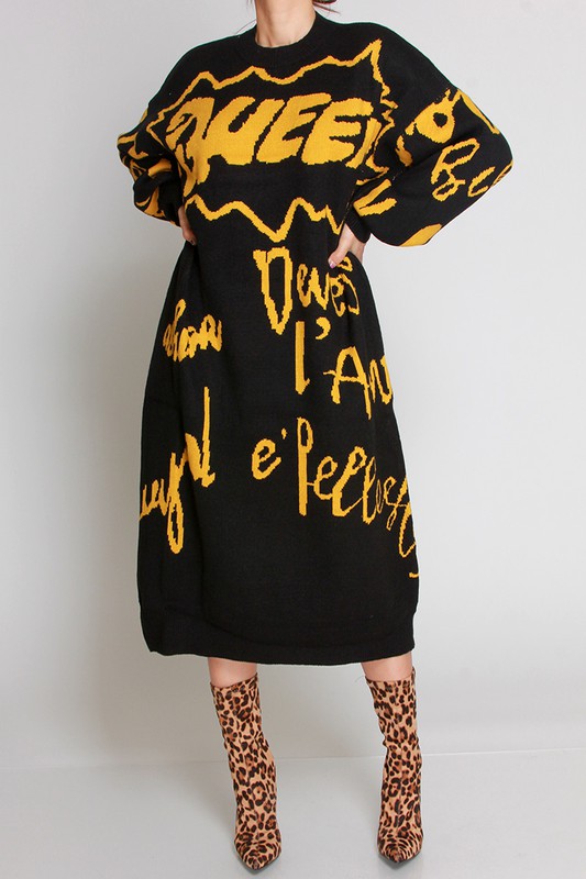 Model wearing calf-length black dress with “Queen” printed in various languages in black/yellow or blue/yellow.