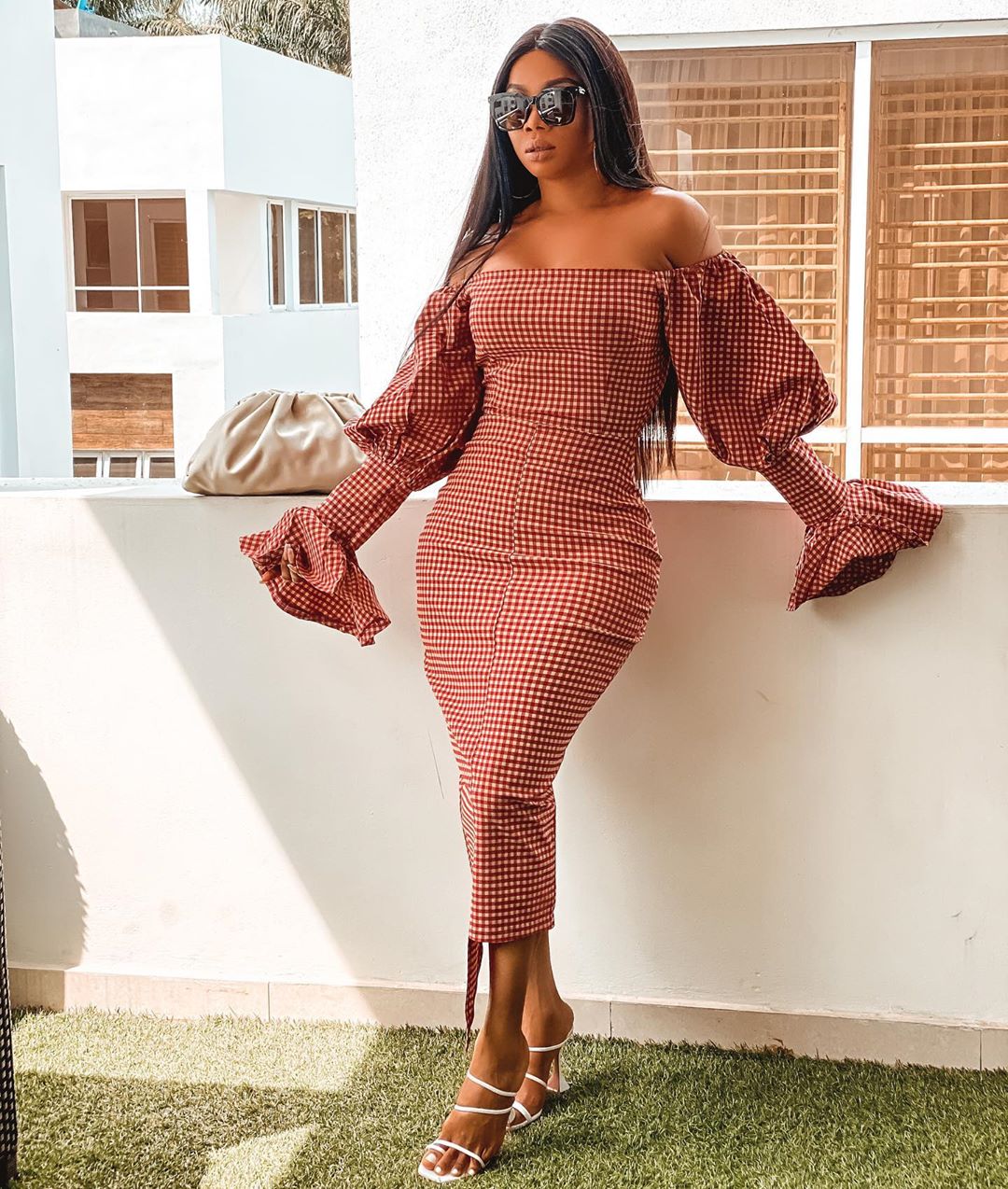 Toke Makinwa structured checkered dress with exaggerated sleeves