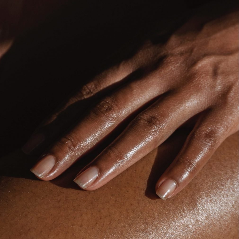 picture of a black woman with healthy nails and health