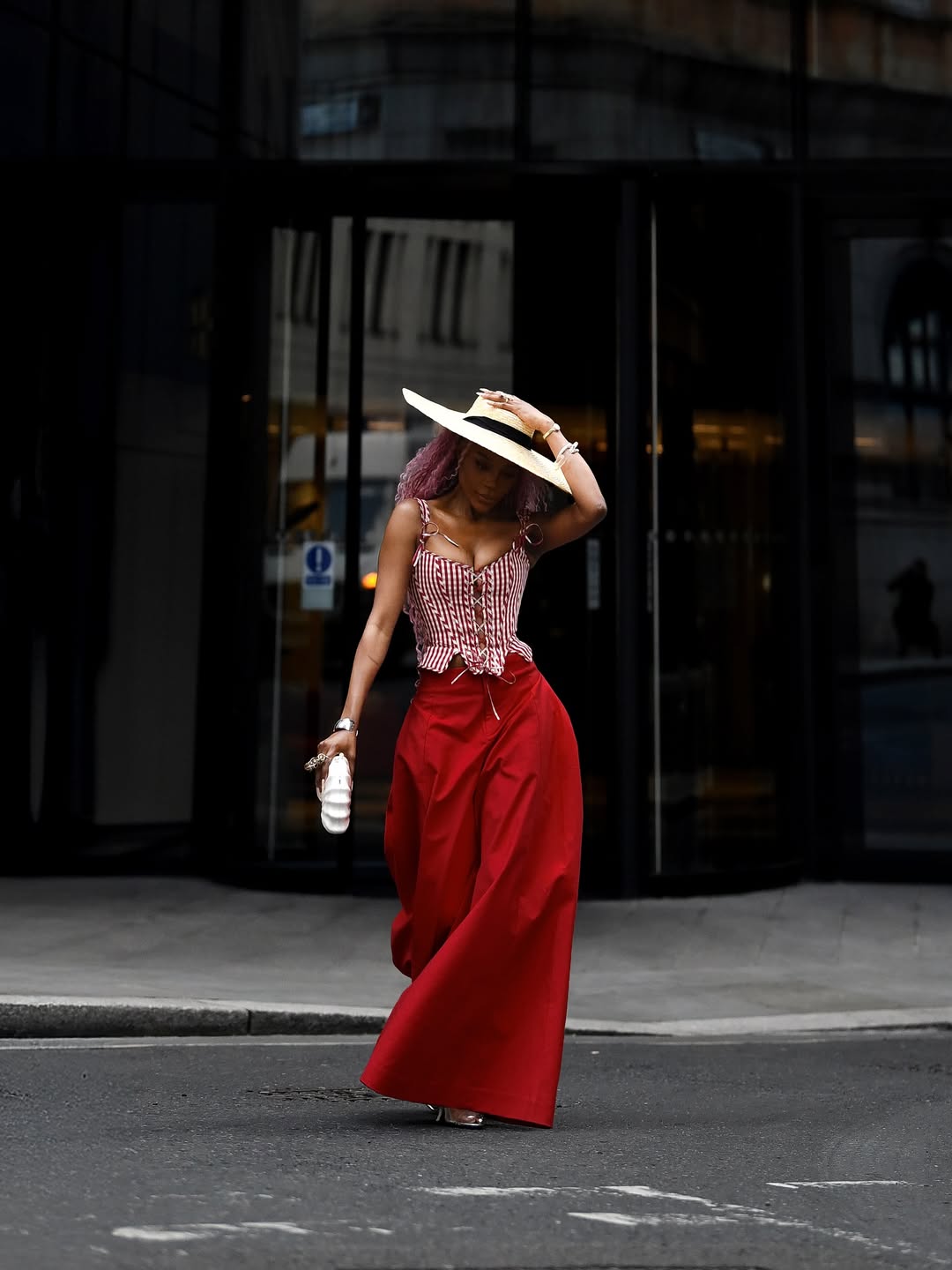 woman wearing sweetheart neckline corset top with baggy pants 