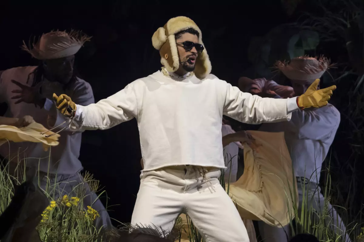 Bad Bunny performing on stage in signature style