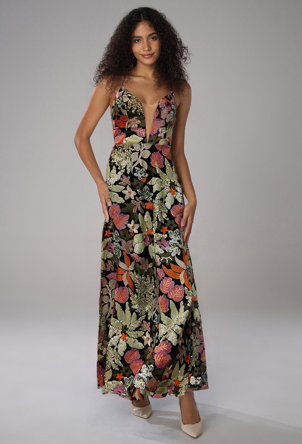 woman wearing a floral fall wedding guest dresses