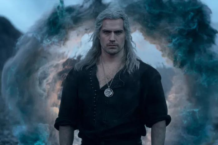 Henry Cavill as Geralt of Rivia in The Witcher, showcasing his iconic silver-haired look from earlier seasons