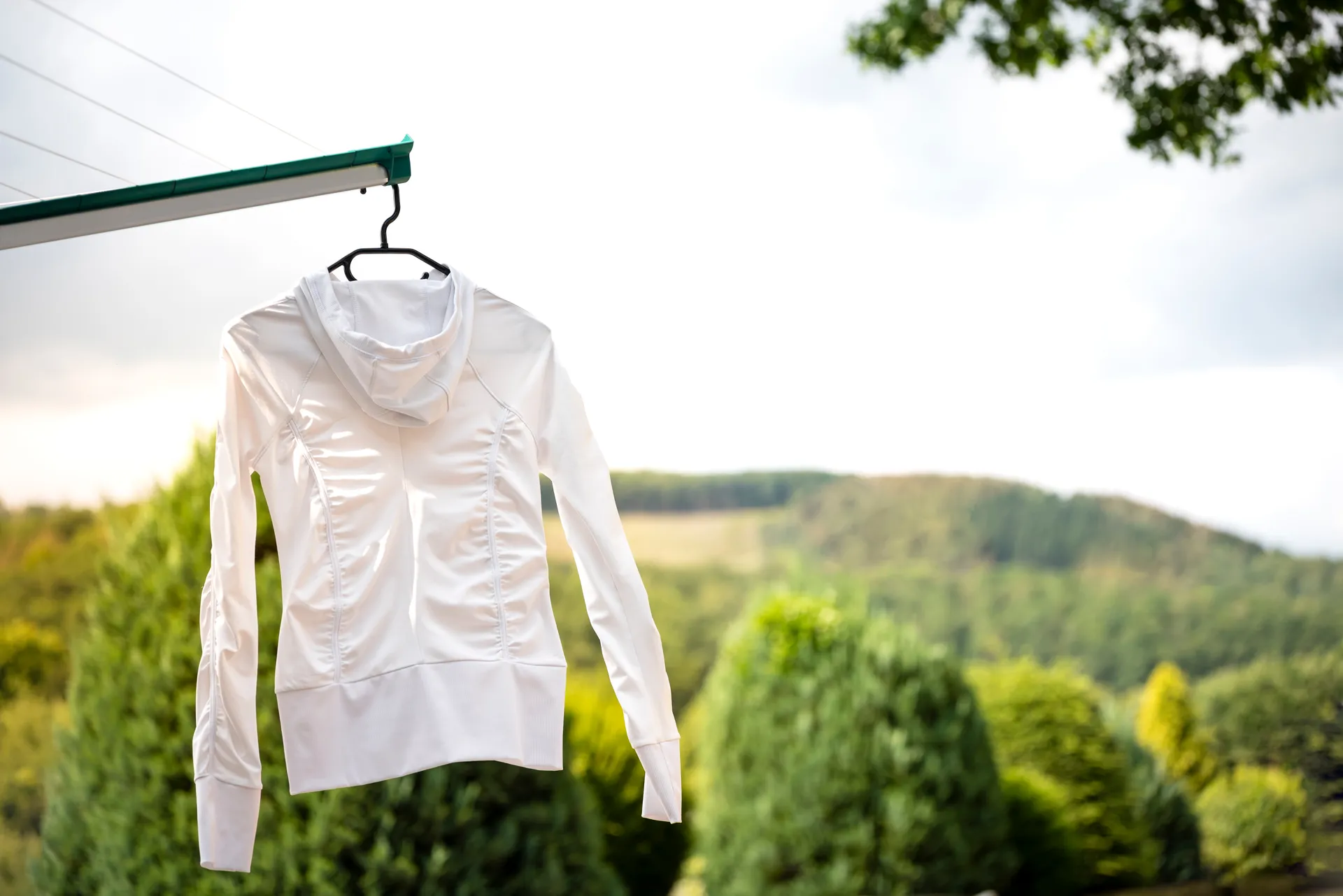 Polyester dress on drying rack — how to prevent polyester clothes from shrinking