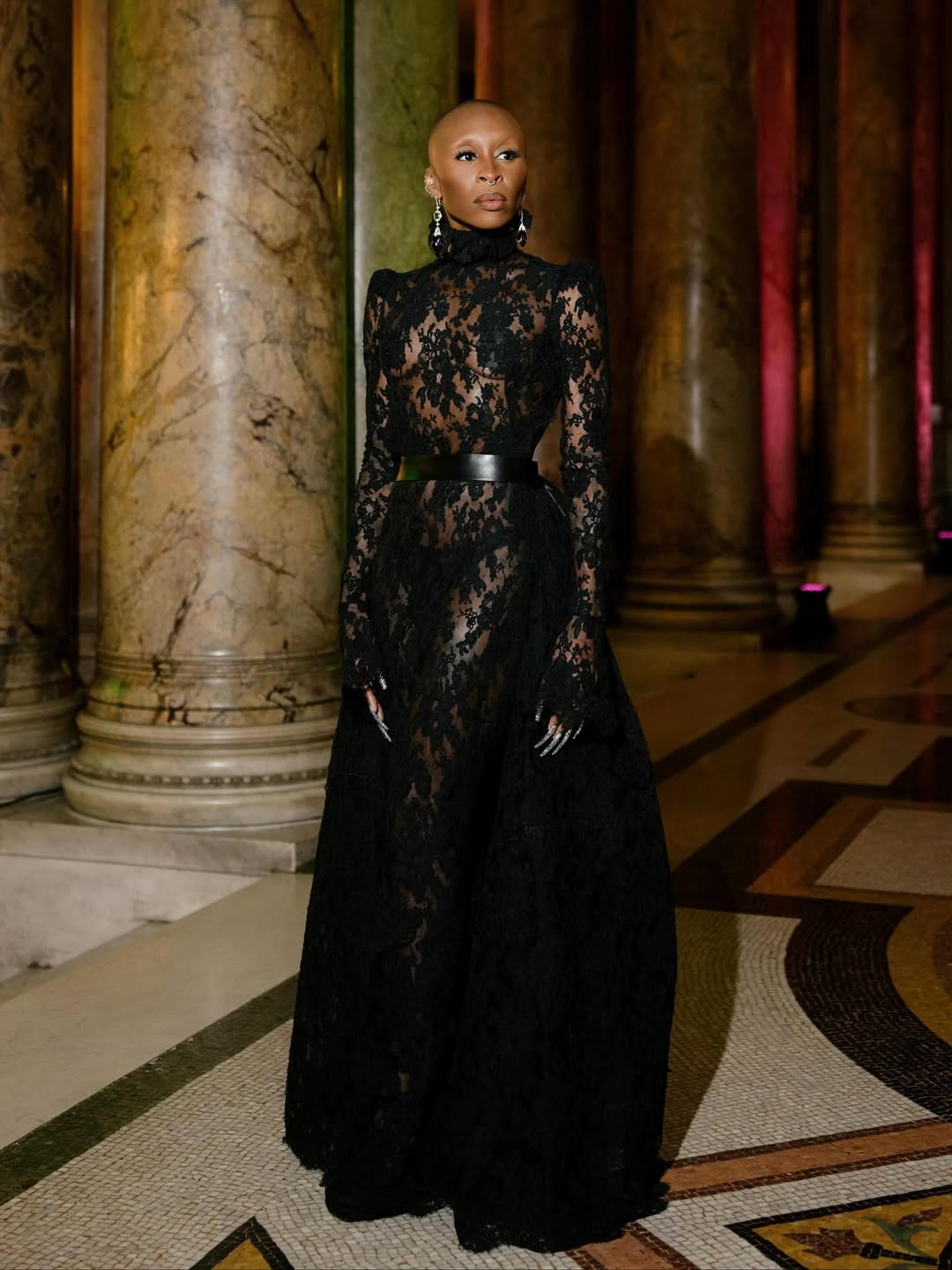 Cynthia Erivo at A Night at the Opera in a sheer black lace Givenchy gown, styled by Jason Bolden, shining in one of the week’s standout red carpet moments.