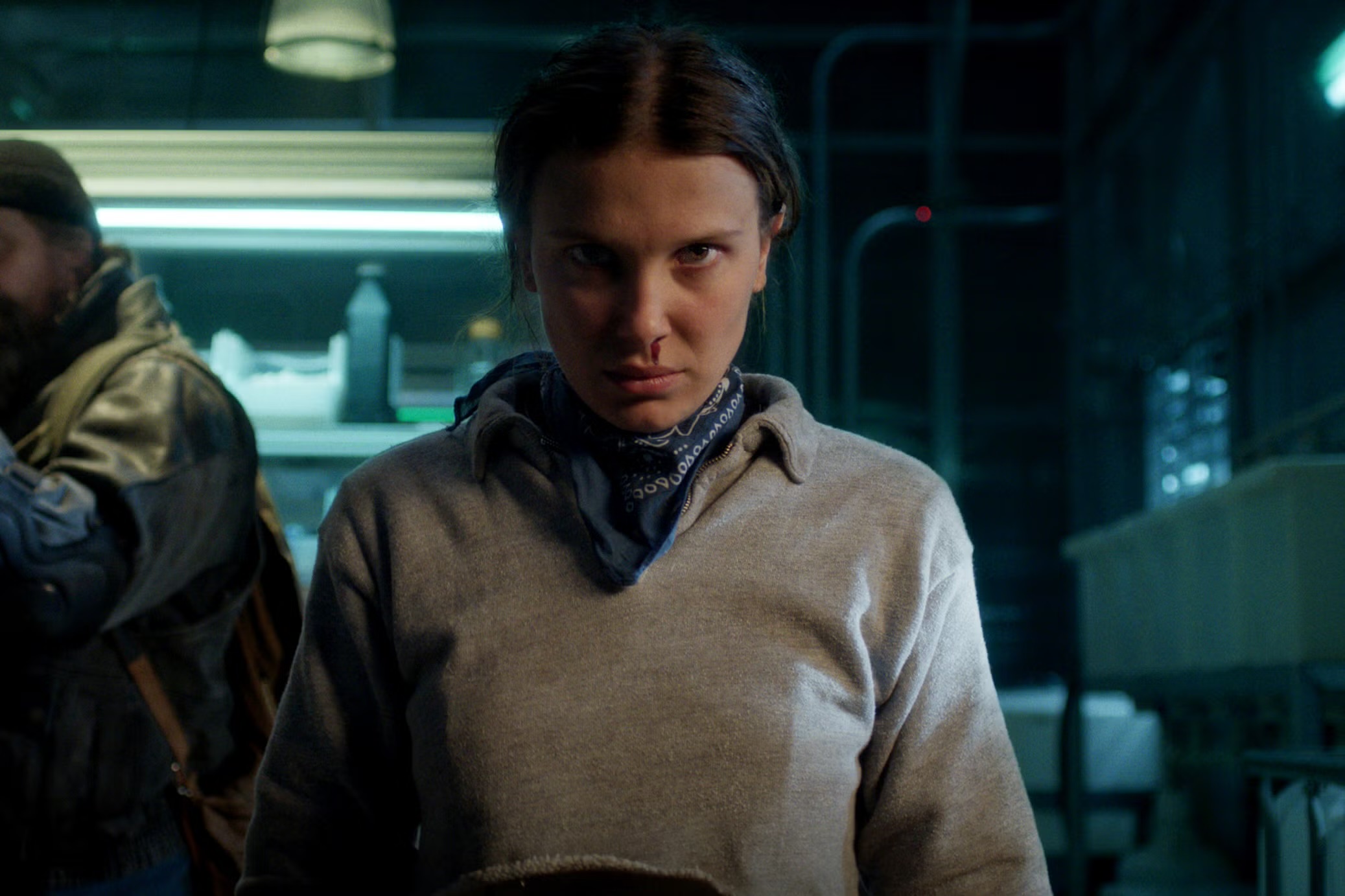 Millie Bobby Brown as Eleven in Stranger Things Season 5, capturing both the emotional weight and the tensions surrounding her character’s return.