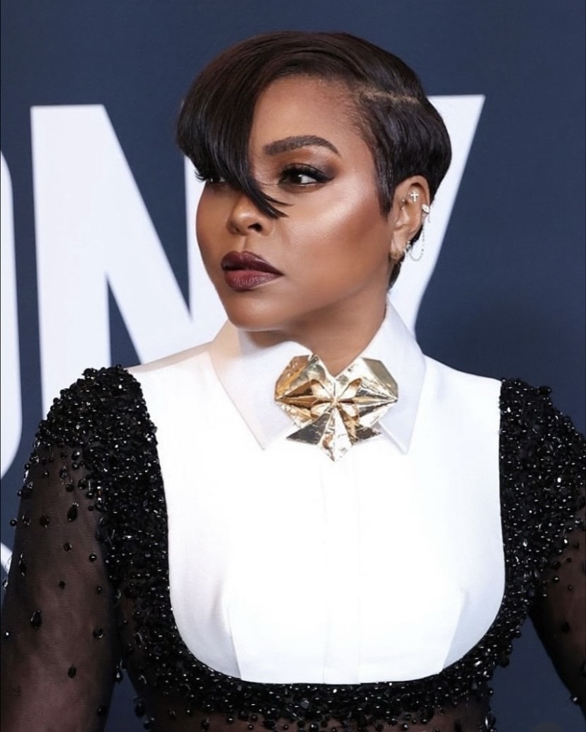 Taraji P. Henson in expressive beauty look with asymmetrical pixie cut and dramatic side-swept bang.