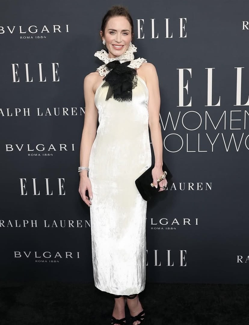 Emily Blunt in a pearl-toned Ralph Lauren gown styled as a clean, modern celebrity Thanksgiving outfit inspiration.