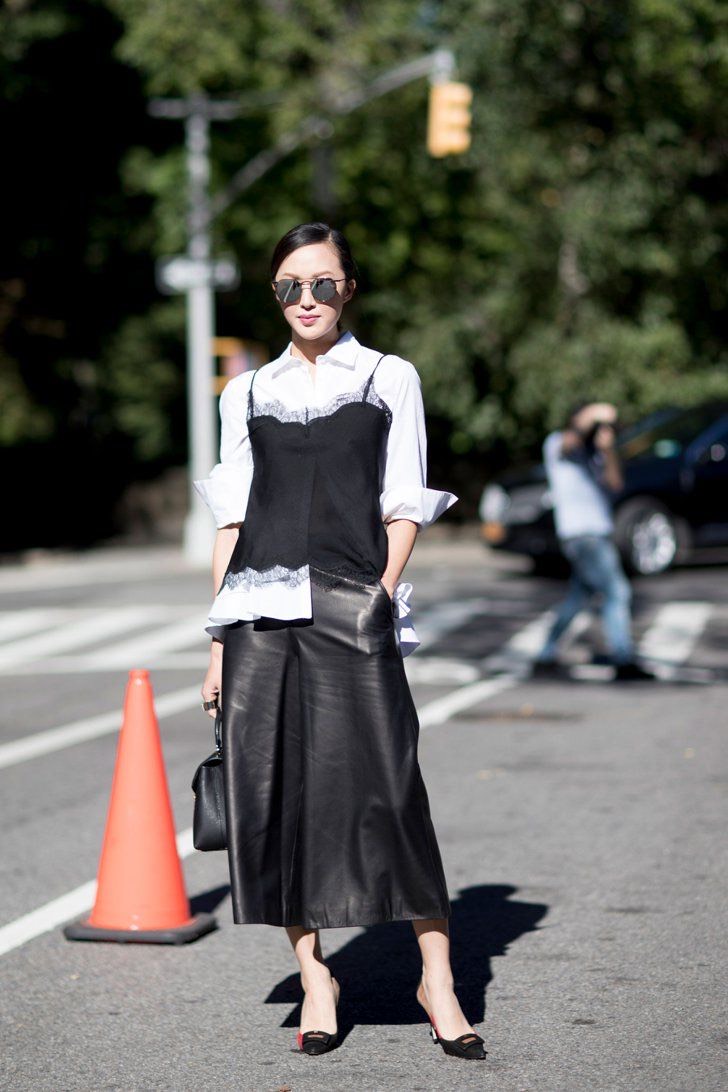 Street-style outfit featuring lace slip layering, showcasing the lingerie as clothes trend.
