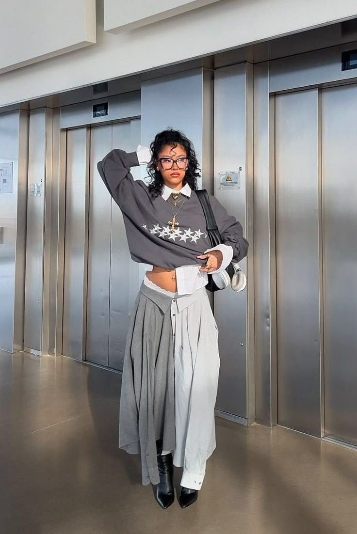 woman wearing autumn outfits of sweater and shirt skirt