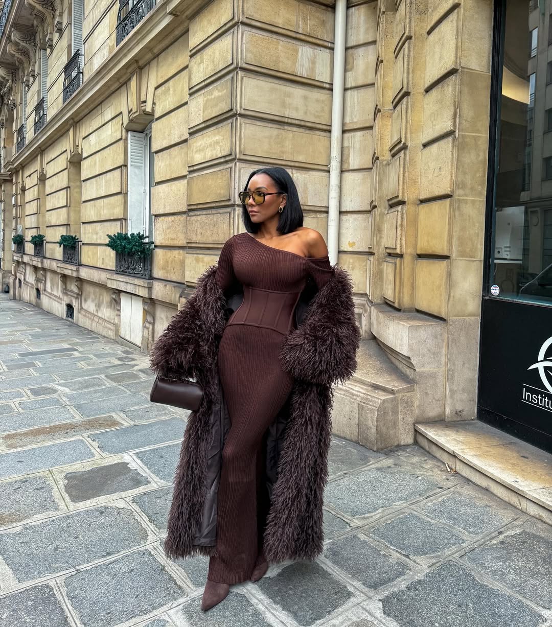 woman wearing knit set with coat as fall fashion trend in 2025