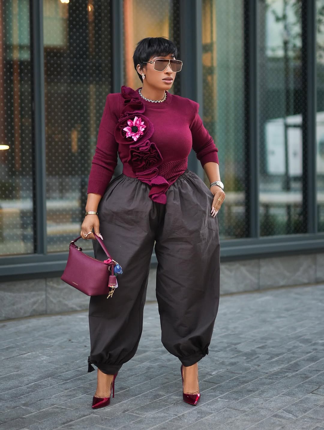 woman wearing balloon pants and sweater outfit for new year's eve 
