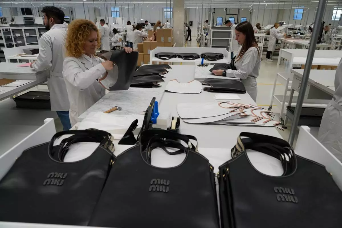 Leather good operators work at the Prada factory in Scandicci, Italy.