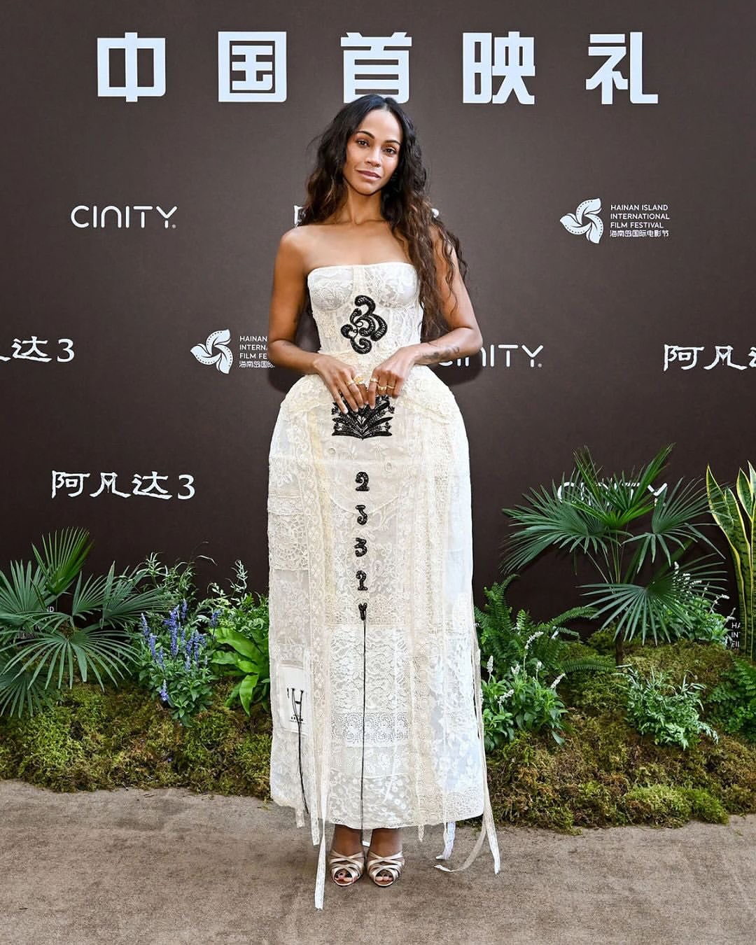 Zoe Saldaña at the Avatar Fire and Ash China premiere wearing an Erdem Spring Summer 2026 skeletal bustier cage dress crafted from antique lace.