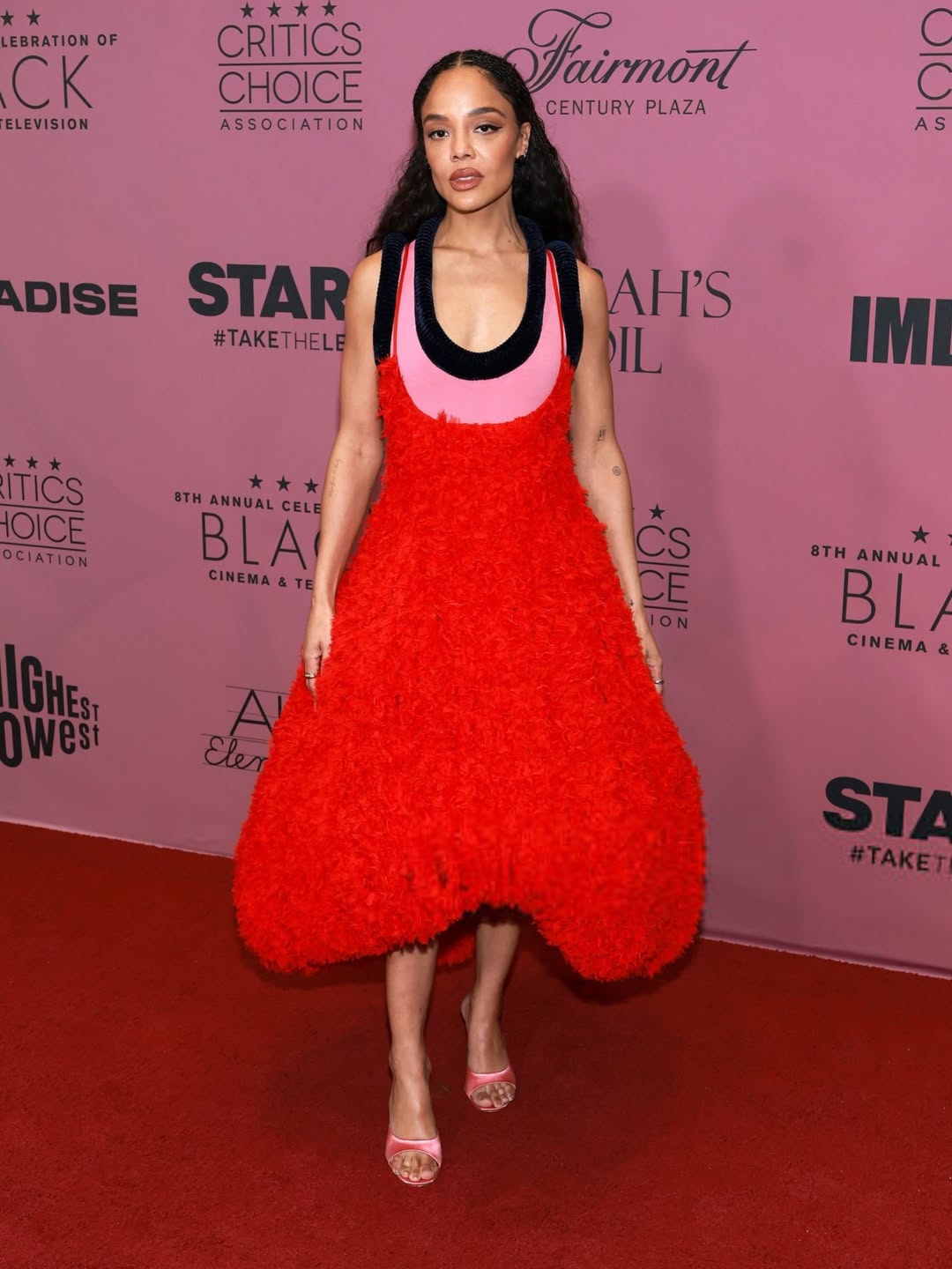 Tessa Thompson attending the Critics Choice Association Celebration of Black Cinema and Television wearing a refined Diotima ensemble.