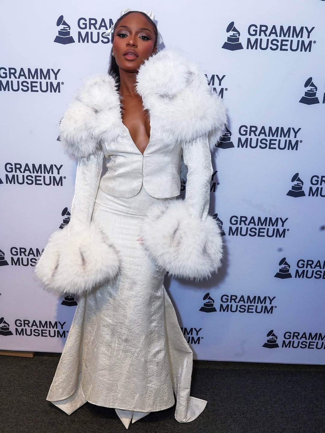 Ayra Starr attends the GRAMMY Museum wearing a Kim Shui Fall/Winter 2025 Look 17, styled by Elly30, delivering sleek high-fashion drama.