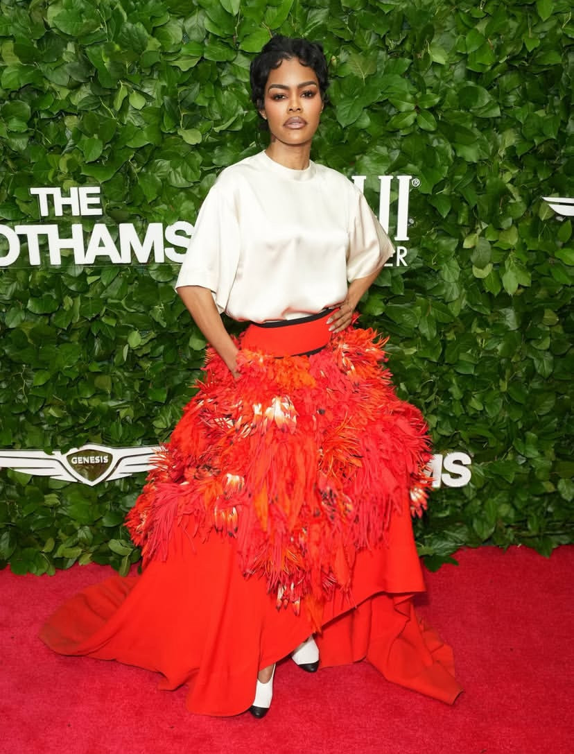 Teyana Taylor in a white top and voluminous red Chanel skirt at the Gotham Awards, echoing the bold energy of the Fashion Awards 2025 best look.