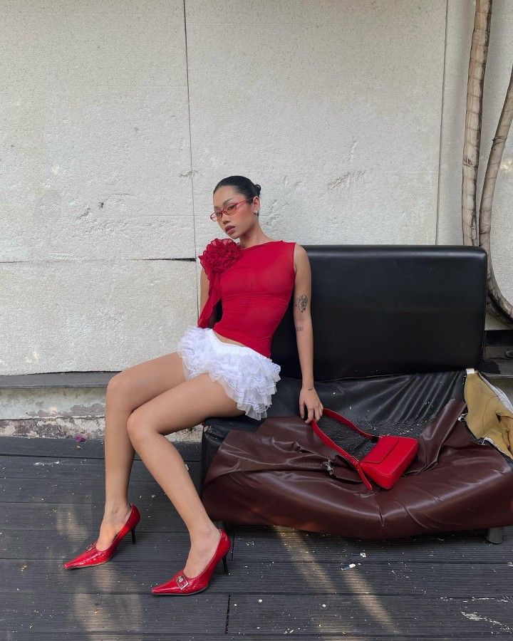 Bloomer shorts outfit paired with red fitted top and kitten heels
