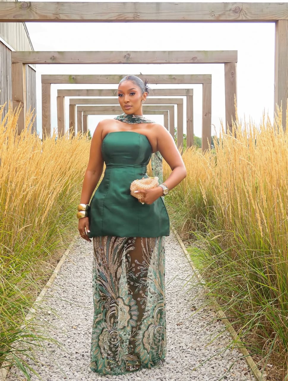 woman wearing green tube dress with translucent panels