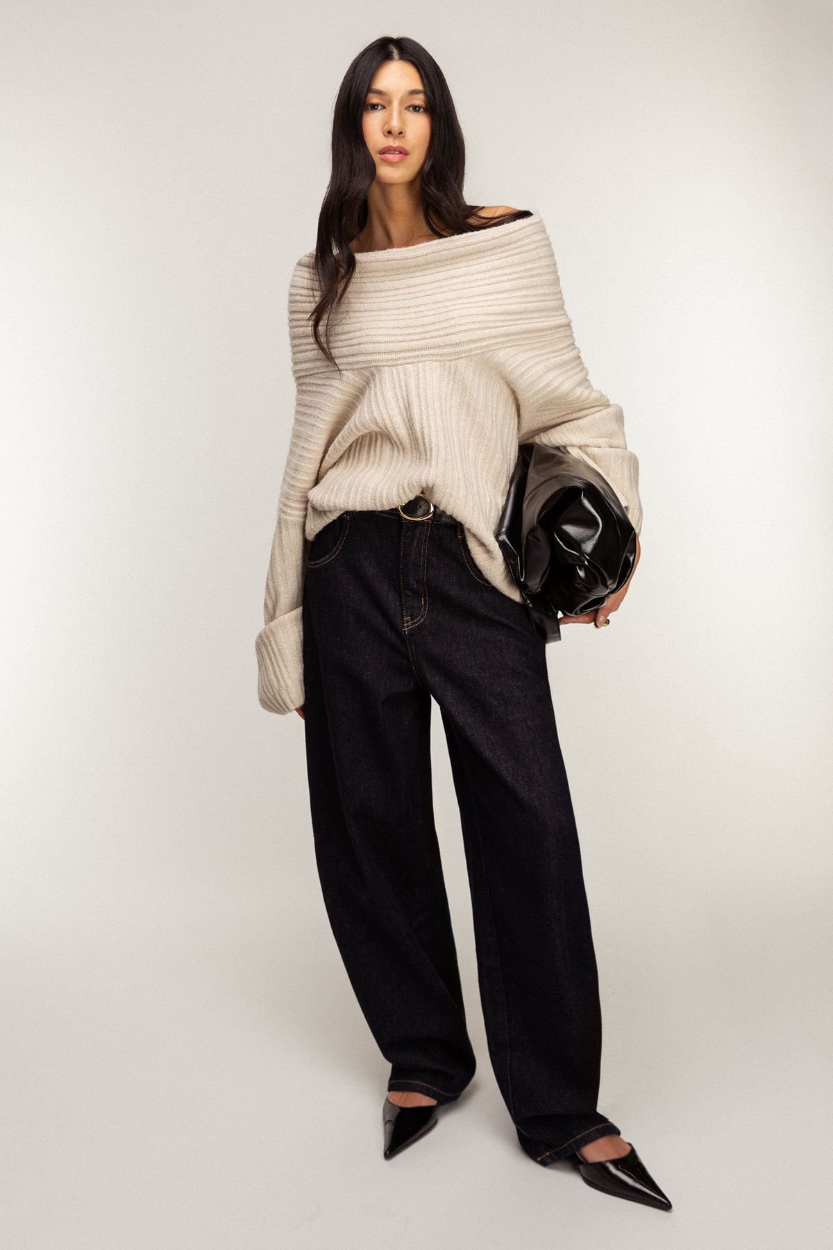 woman wearing sweater with barrel jeans