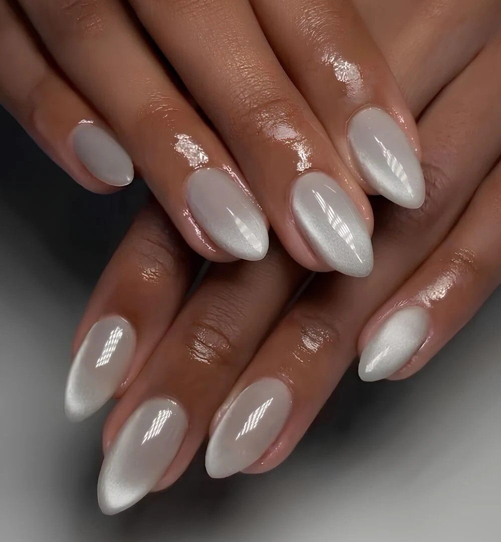 Close-up-of-cloudy-white-nails-with-a-creamy-winter-finish-style-rave