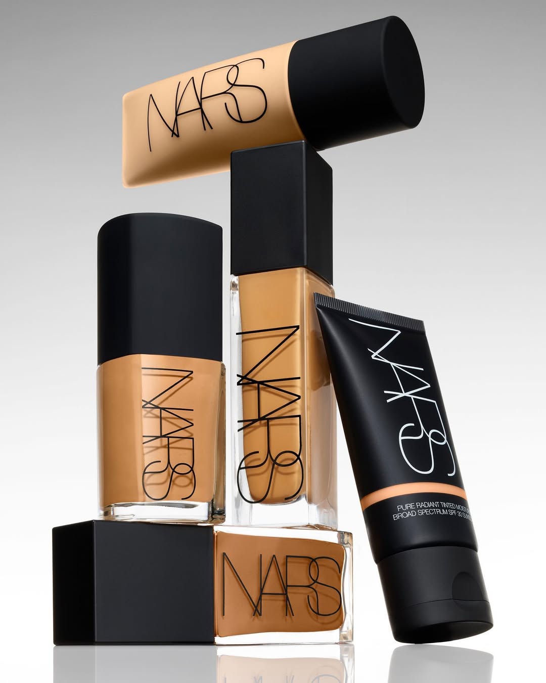 Shade range display of NARS Sheer Glow Foundation tones