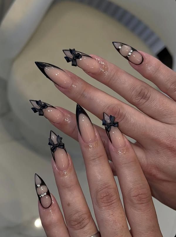 Black french tip manicure inspired by dark coquette aesthetic trend