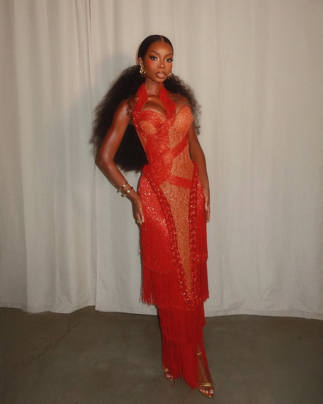 Olandria Carthen embodies poise and confidence in a clean, fashion-forward look.