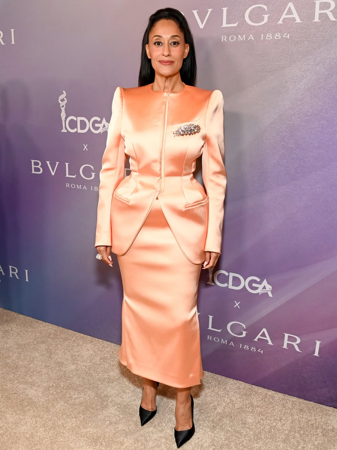 Tracee Ellis Ross at the Costume Designers Guild Awards in a dramatic high-fashion gown with statement silhouette.