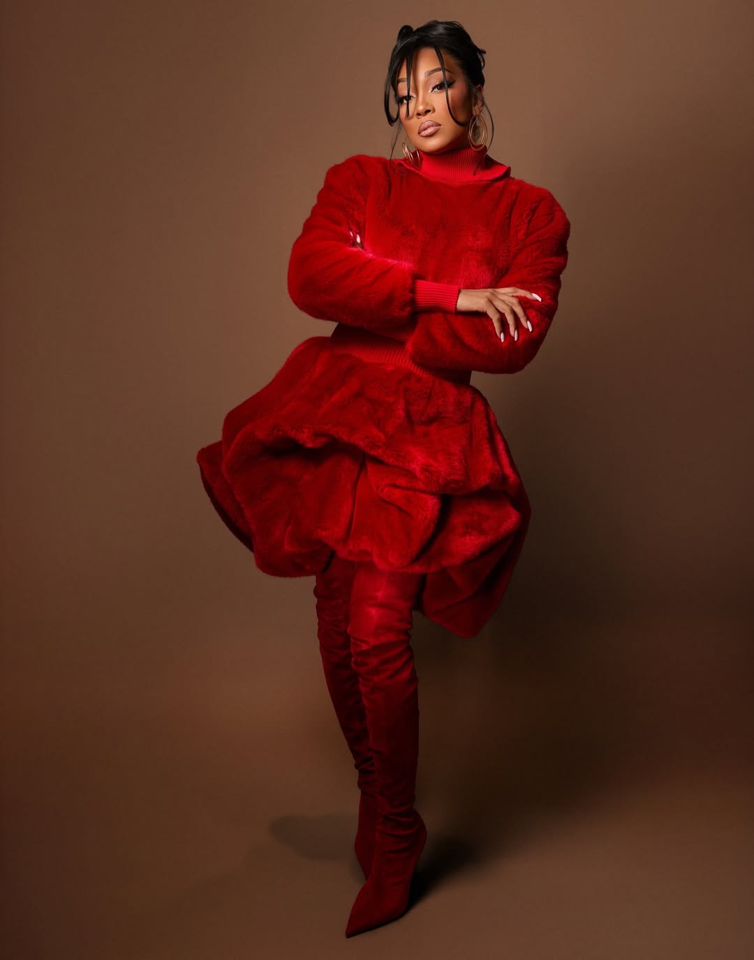 Monica Denise in a glamorous Christian Siriano design featuring dramatic structure and luxe detailing.