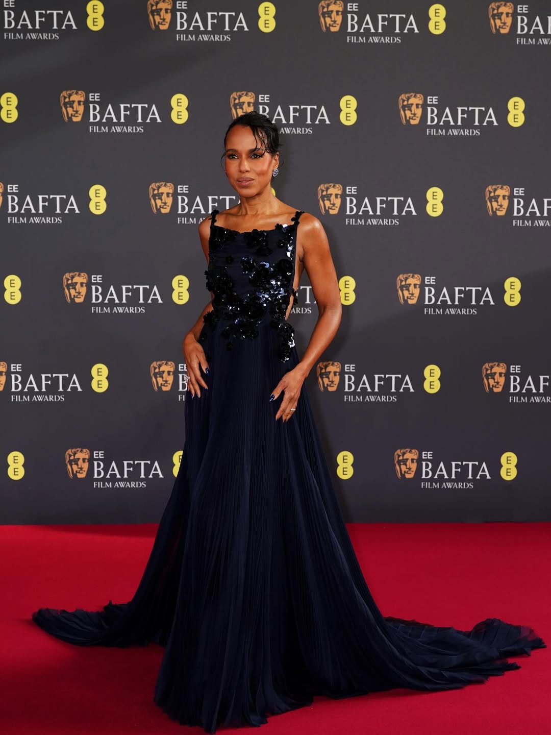 Kerry Washington at the BAFTAs in a polished red carpet ensemble with refined silhouette and sophisticated styling.