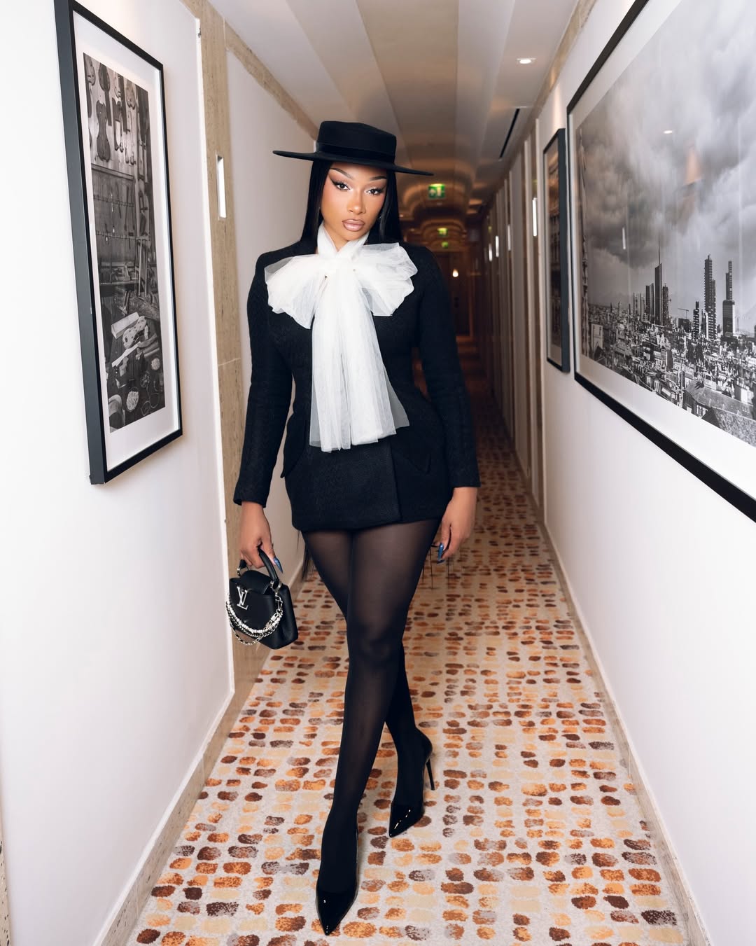 Megan Thee Stallion in Milan wearing a bold fashion-forward ensemble during day one of Fashion Week appearances.