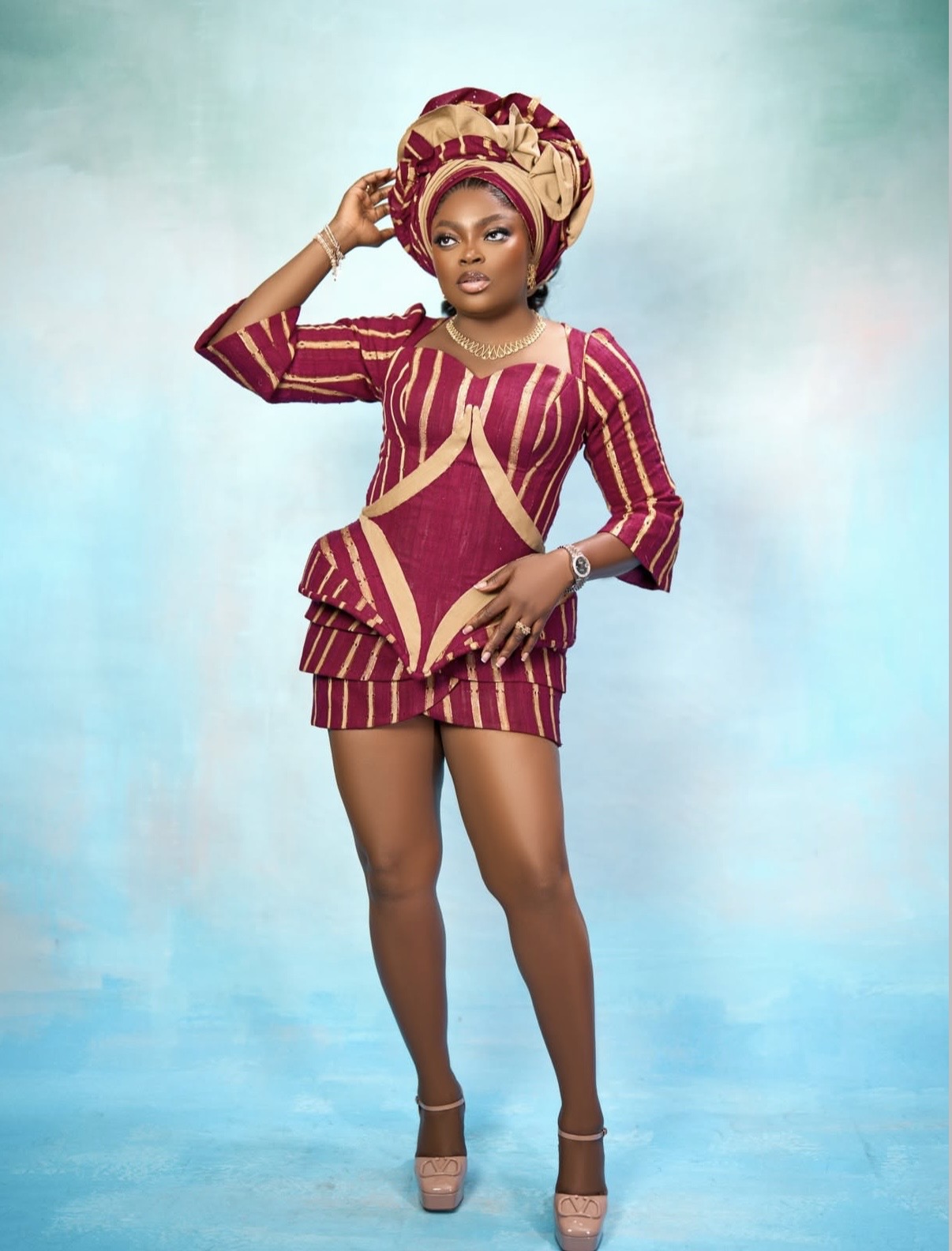 Funke Akindele in burgundy and gold modern Aso Oke ensemble at the Love and New Notes film premiere