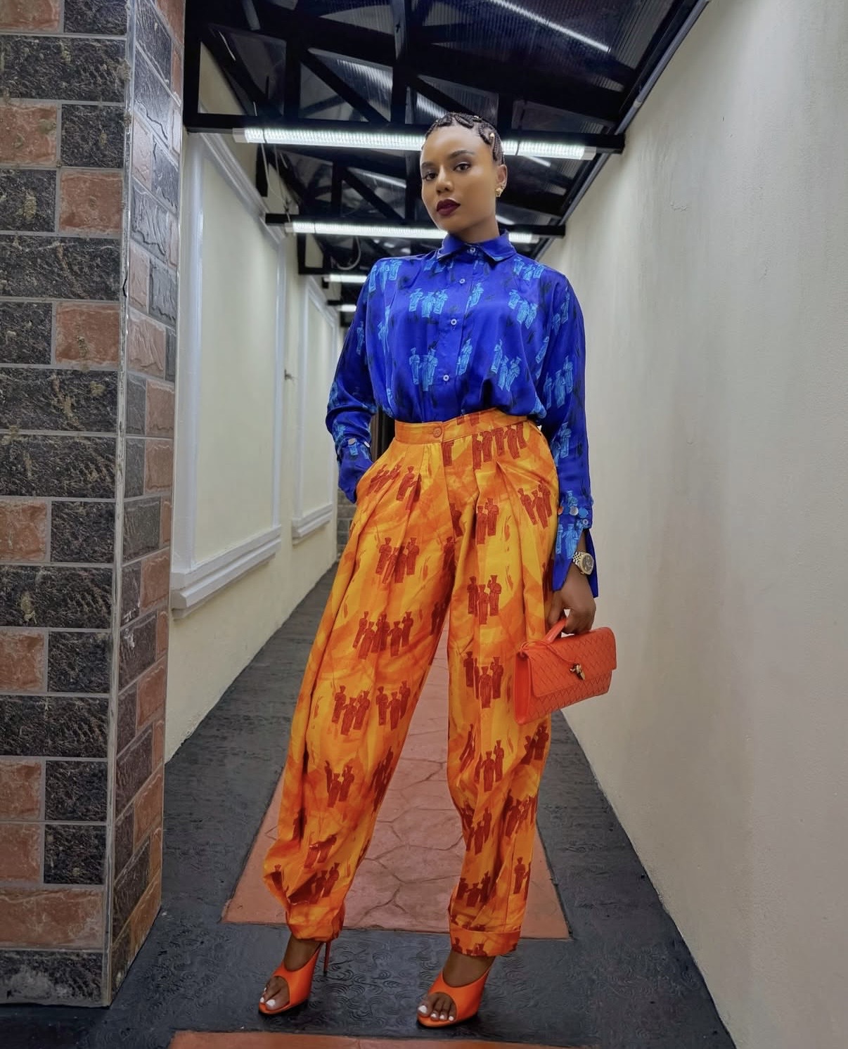 Nancy Isime in vibrant Isaleeko by Derin printed shirt and wide-leg trousers ensemble— Love and New Notes film premiere style reference