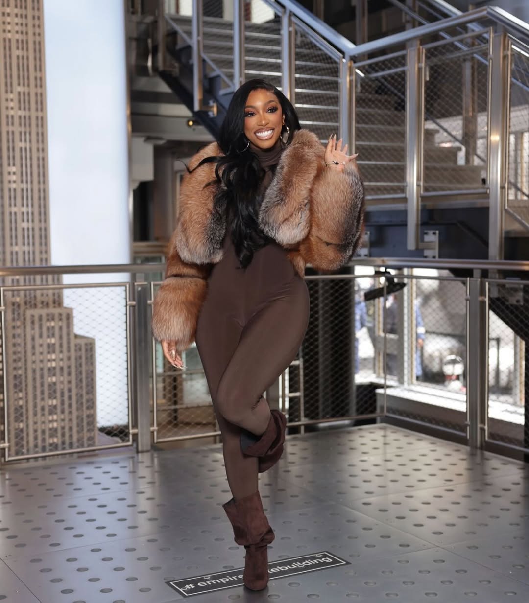 porsha williams wearing a brown thermal jumpsuit with a fur coat
