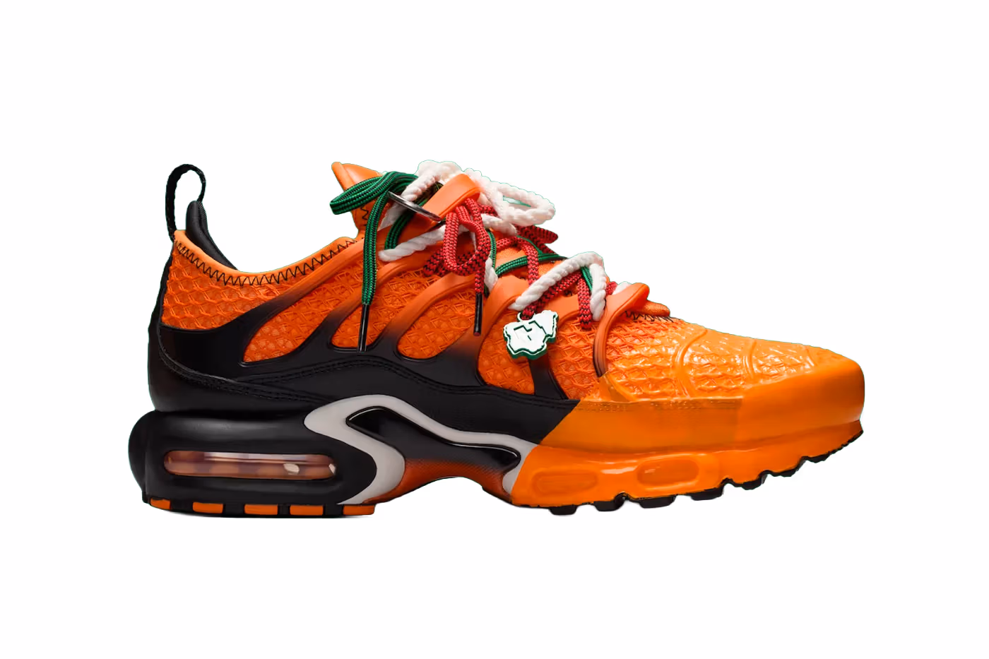 Homecoming x Nike Air Max Plus in Safety Orange fading into Bright Mandarin with layered rope laces and bold TPU cage detailing.
