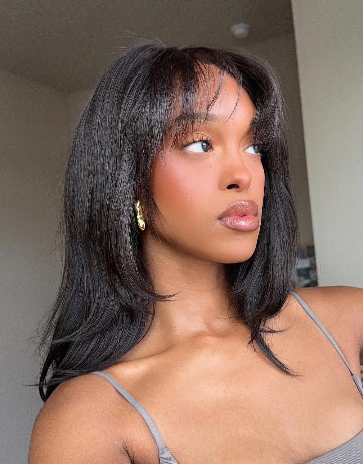 Shoulder-length lob with curtain fringe— curtain bangs styling