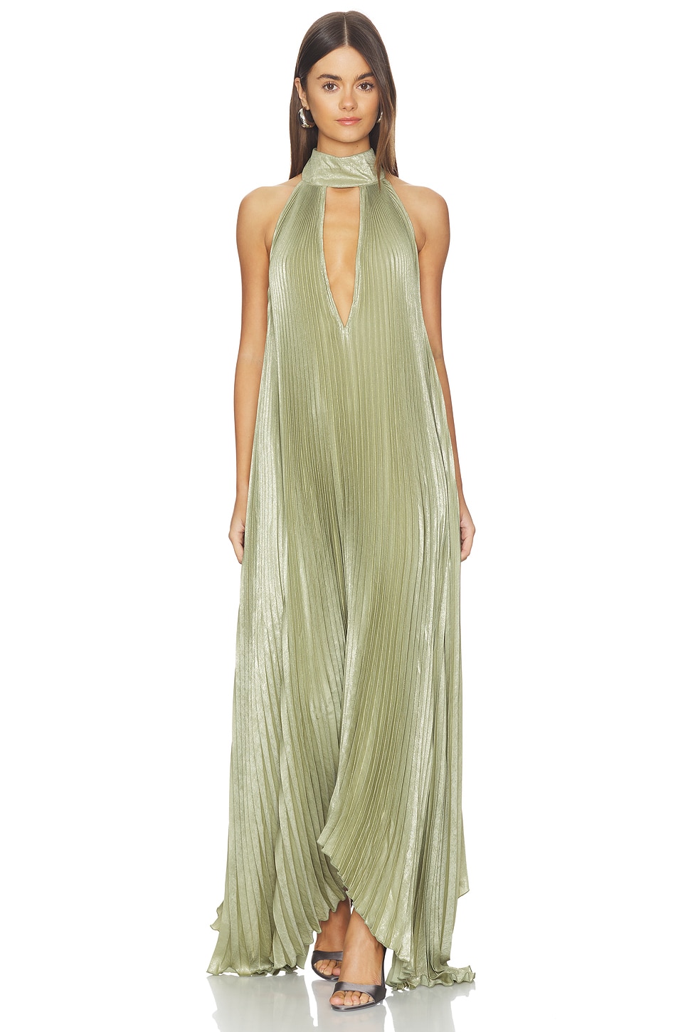 A flowing sage green halter-neck maxi dress styled for an evening look — sage green styling for spring