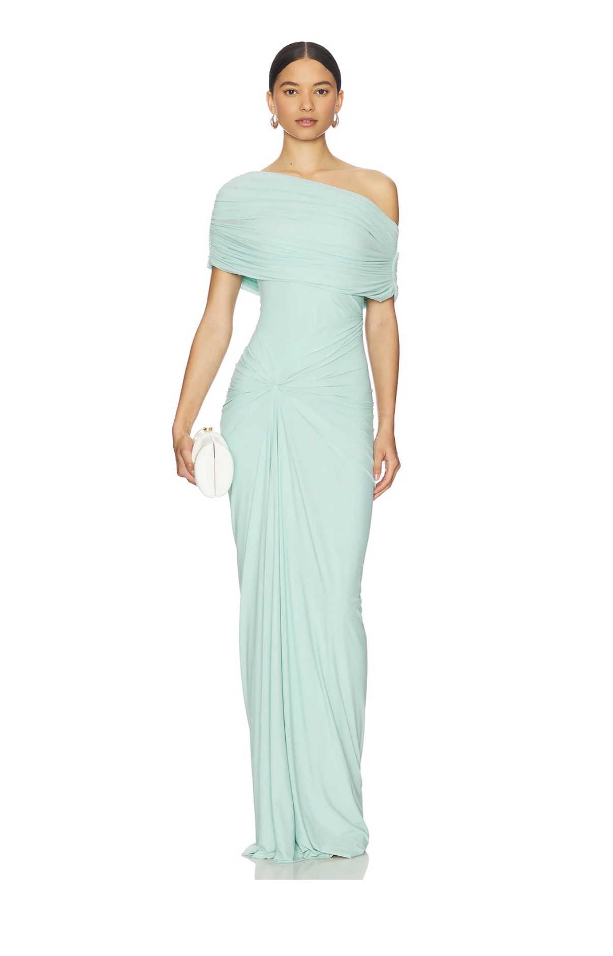A ruched, fitted gown with draped shoulder detail styled for an evening spring wedding guest look —spring wedding guest outfit 