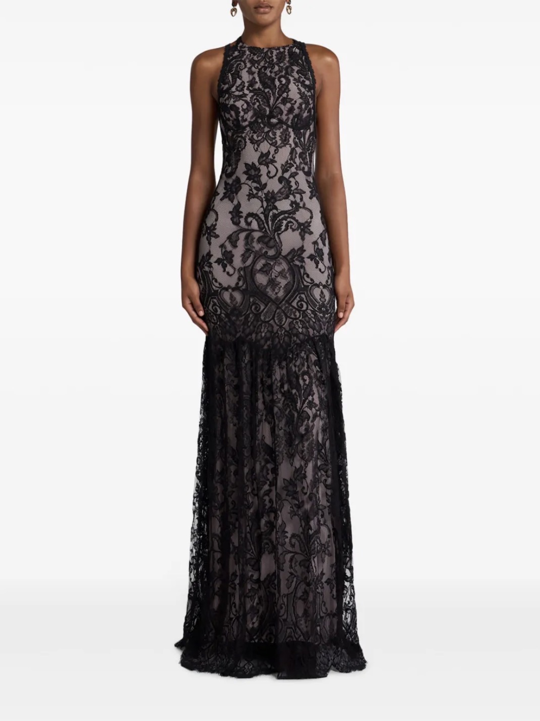 Sheer lace overlay dress styled for a romantic spring wedding guest outfit.