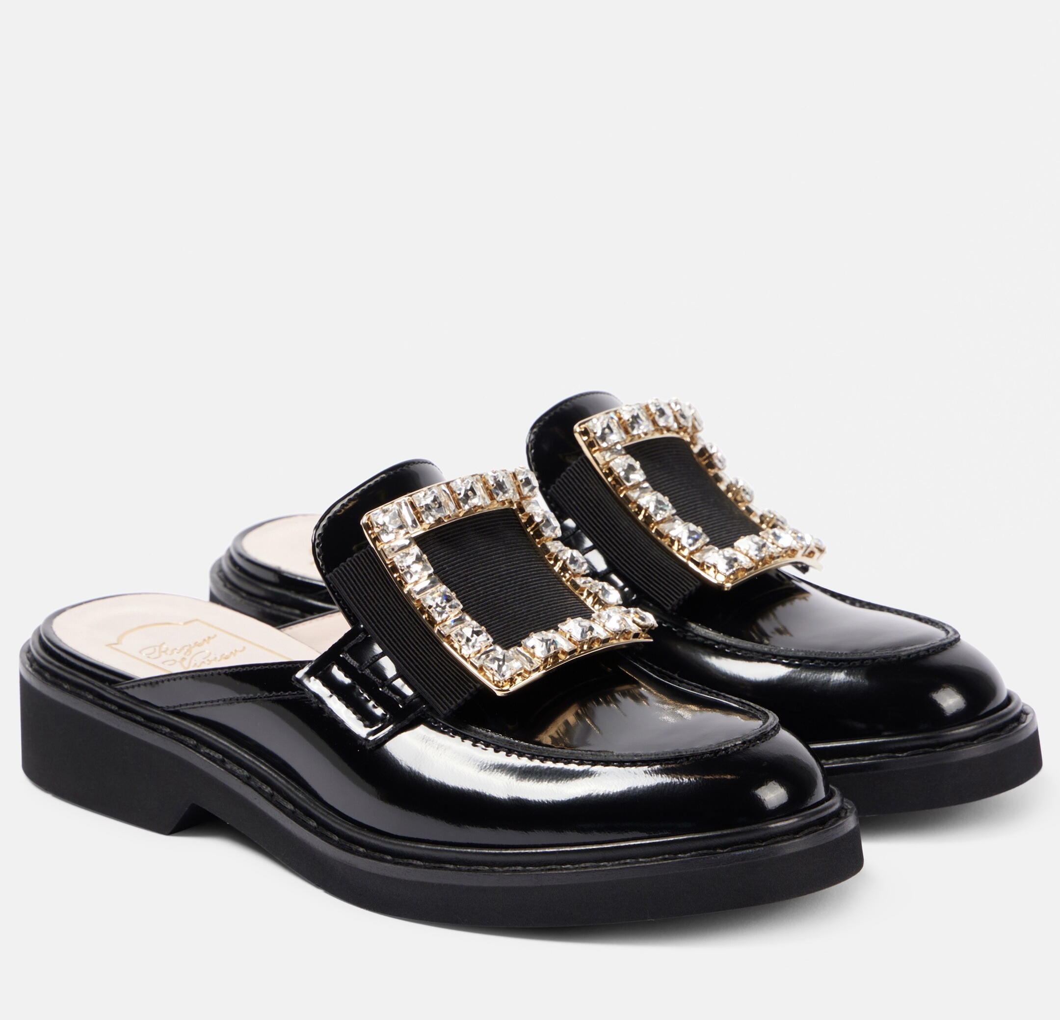 Black leather embellished slip-on mule styled for luxury fashion looks — slip-on dress shoes for women