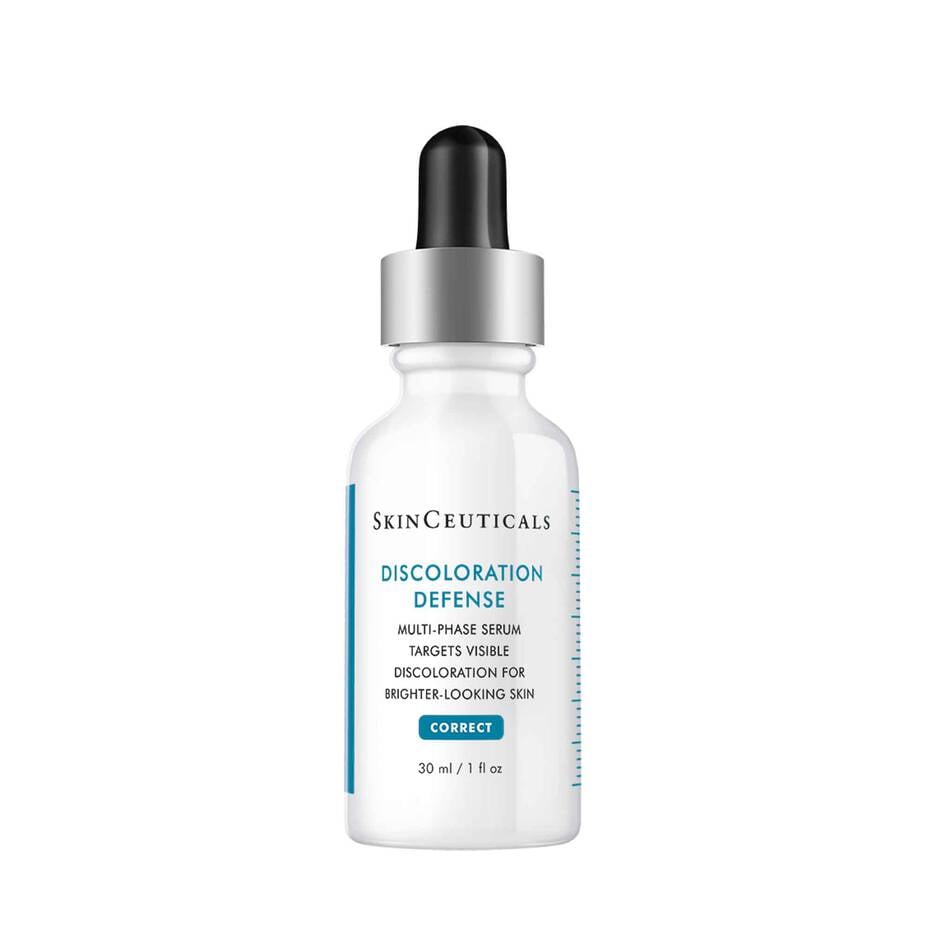SkinCeuticals Discoloration Defense serum bottle on marble surface for hyperpigmentation treatment — top-rated tranexamic acid serum 2026