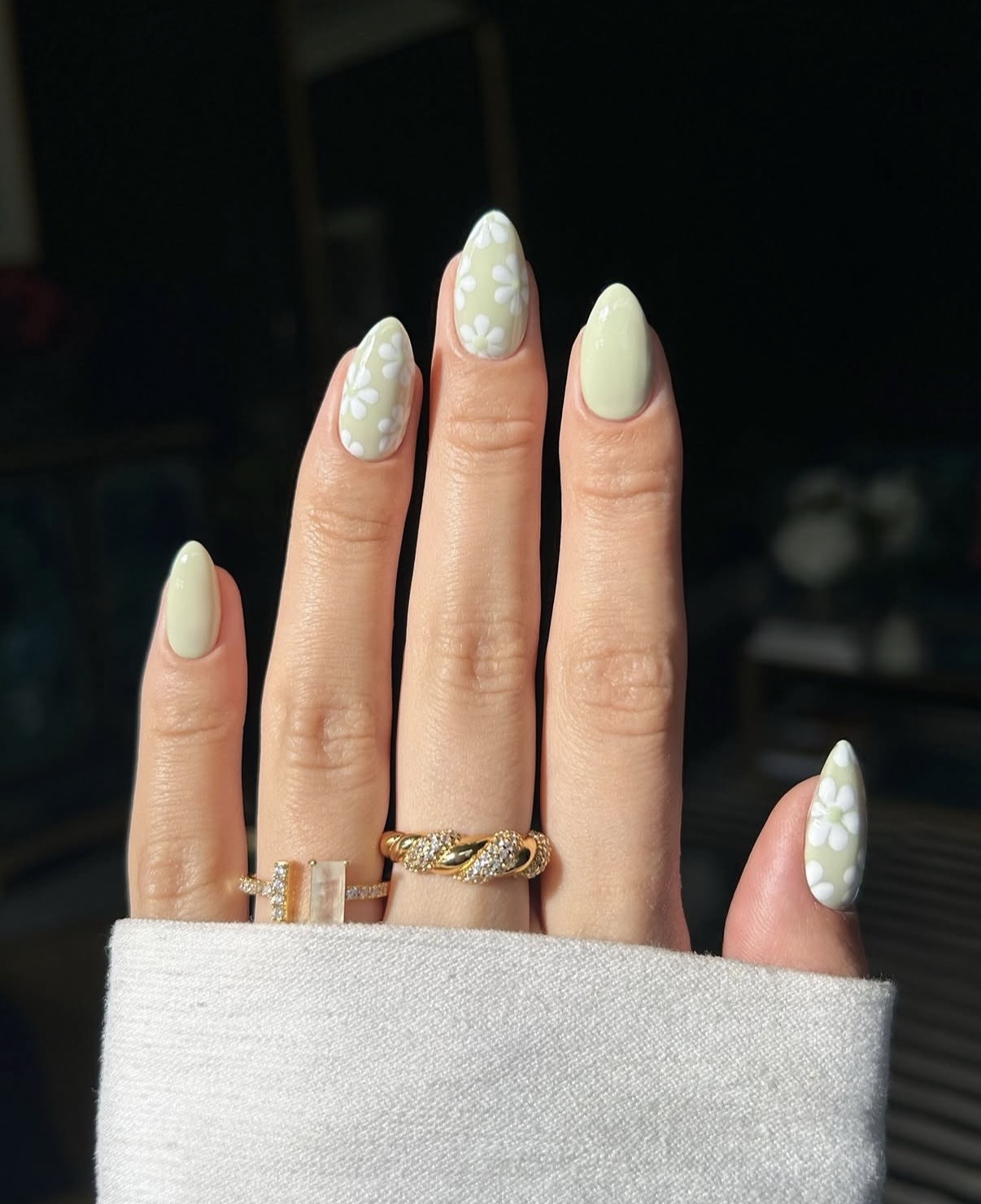 Sage green press-on nails with white floral patterns for spring— sage green nails for spring
