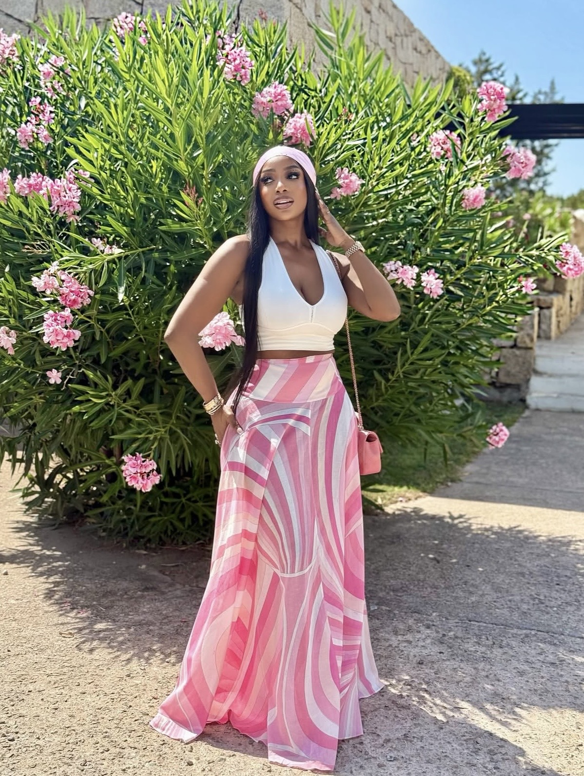 A halter crop top paired with bold printed high-waisted maxi skirt— A-line maxi skirt styling tips