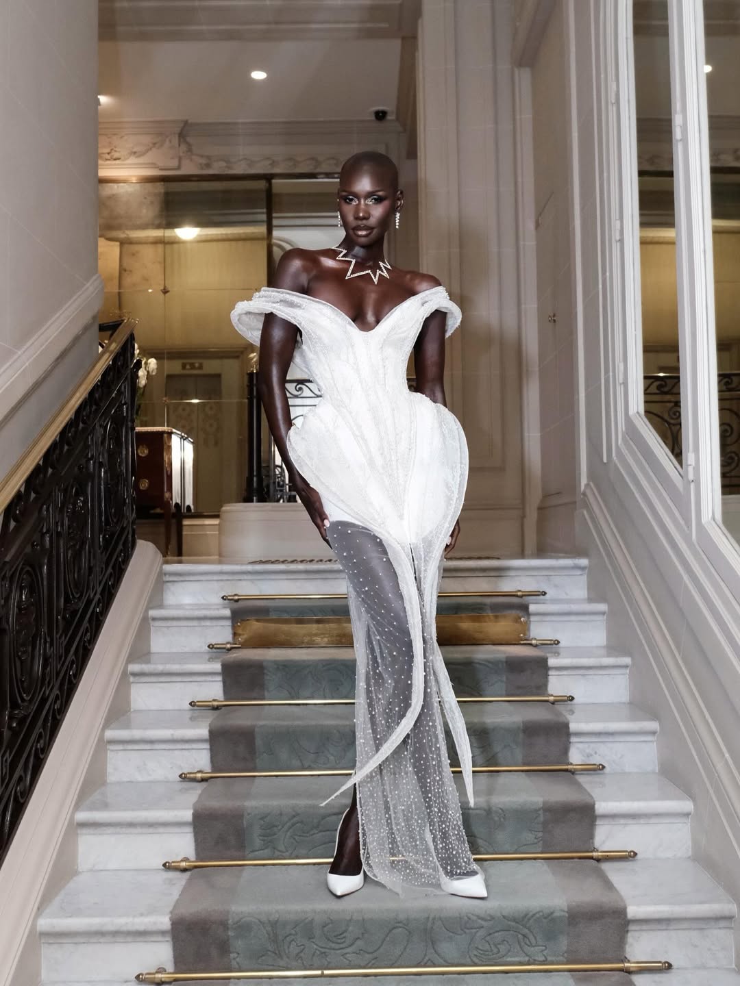 Abdoul Kader Adjagbe
Alt text: Adot attending a glamorous evening event at the Louvre in an elegant couture look.