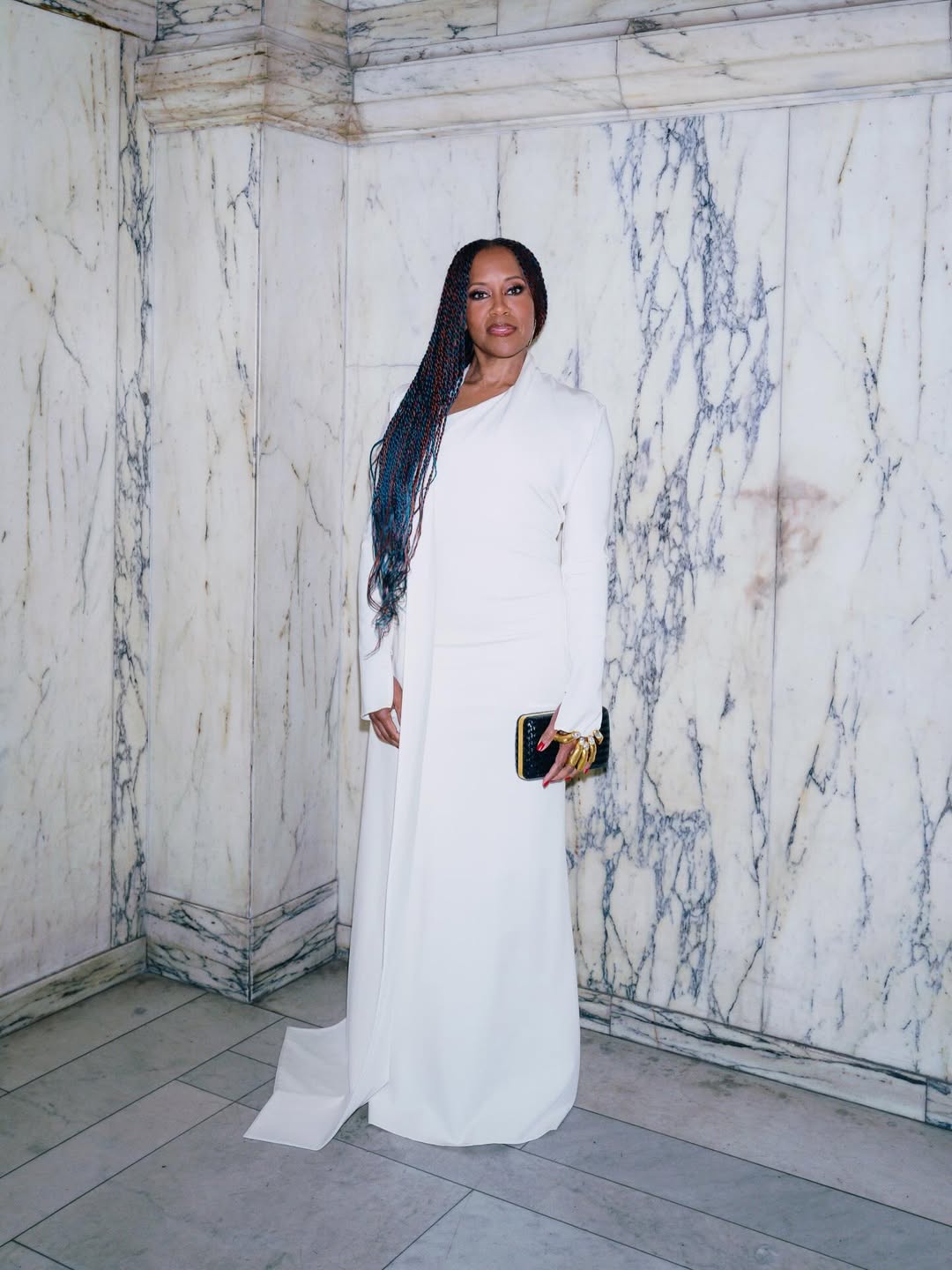 Regina King sleek white gown at Schiaparelli: Fashion Becomes Art exhibition at the V&A Museum London.