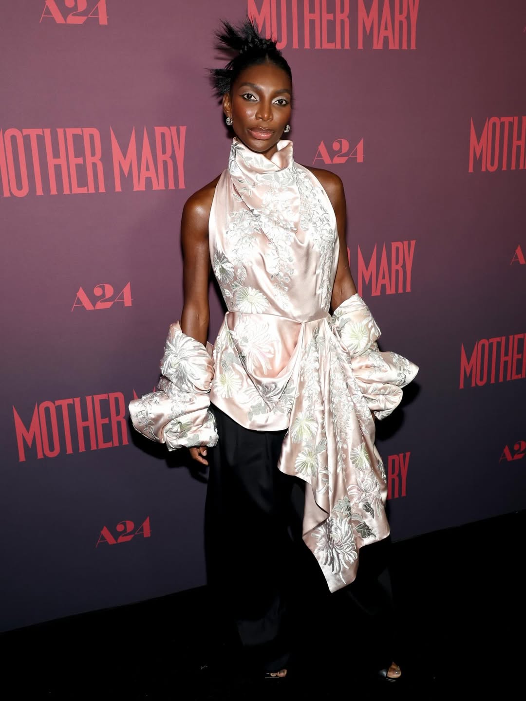 Michaela Coel in a refined red carpet ensemble at Mother Mary NYC premiere.