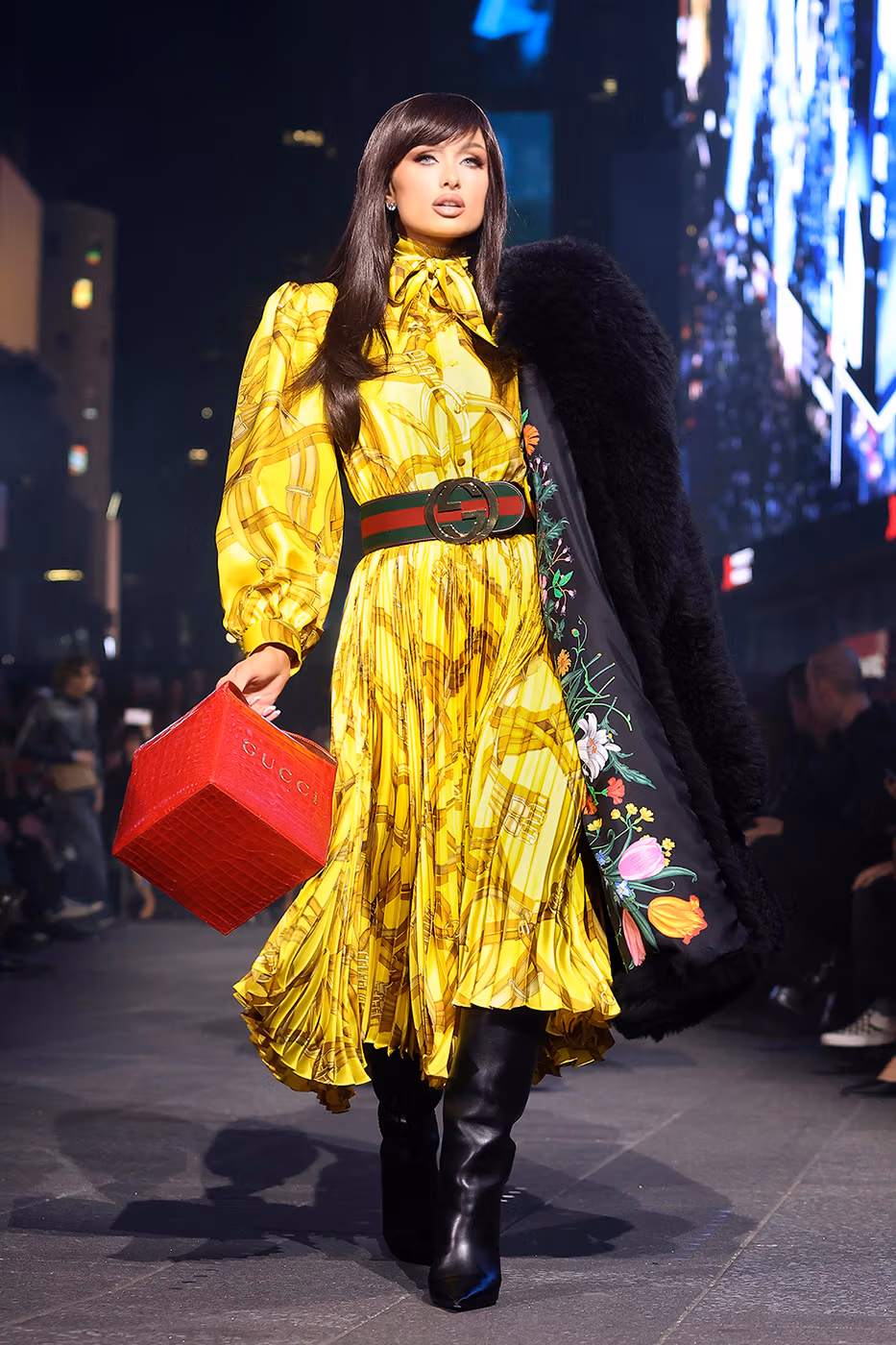 Paris Hilton walking Gucci Cruise 2027 runway in all-leather look Times Square 2026