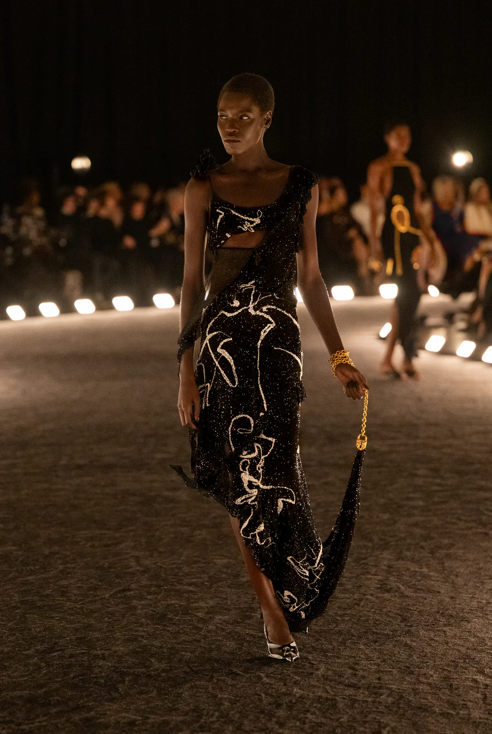 Schiaparelli's Asymmetrical long dress in black metallic knit 
