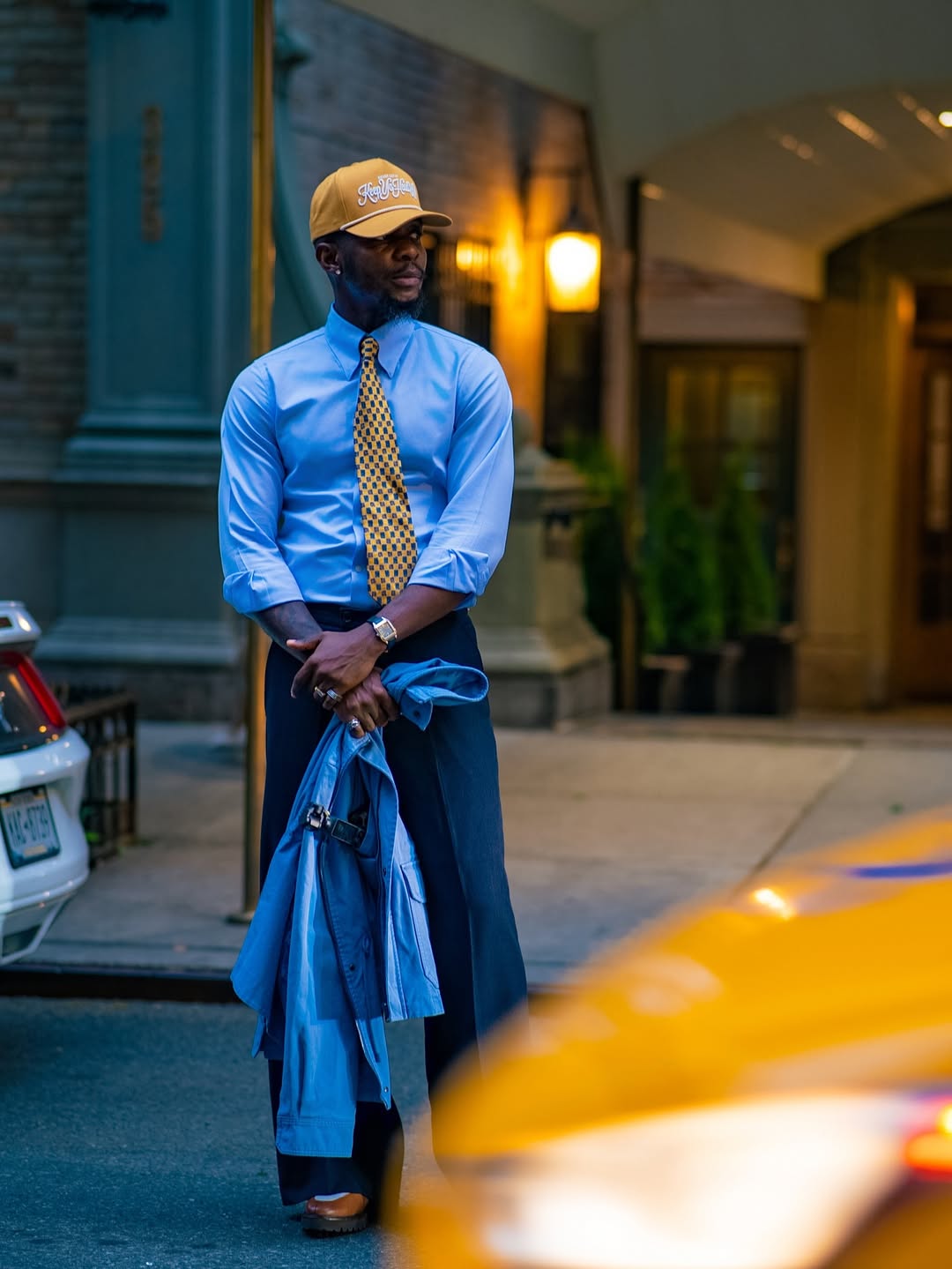 man wearing blue shirt and pants with baseball hair psychology of style